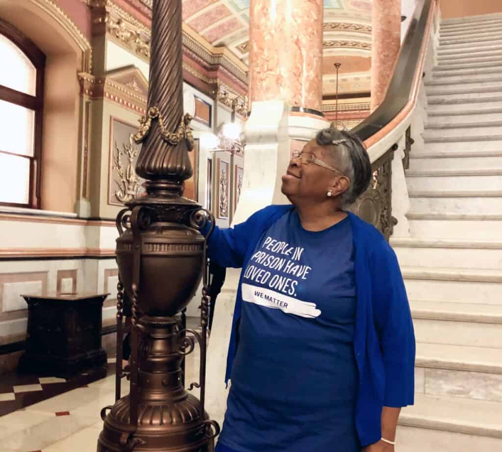 Senior black woman smiling at the state capitol